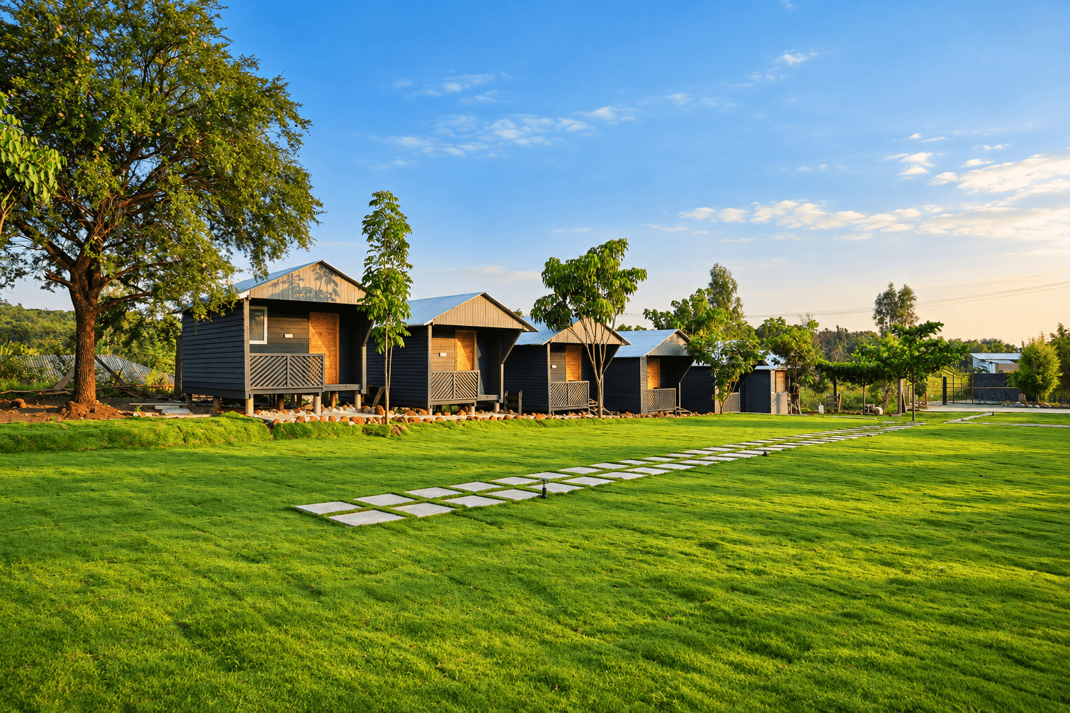 The line of cottages along the edge of the lawn