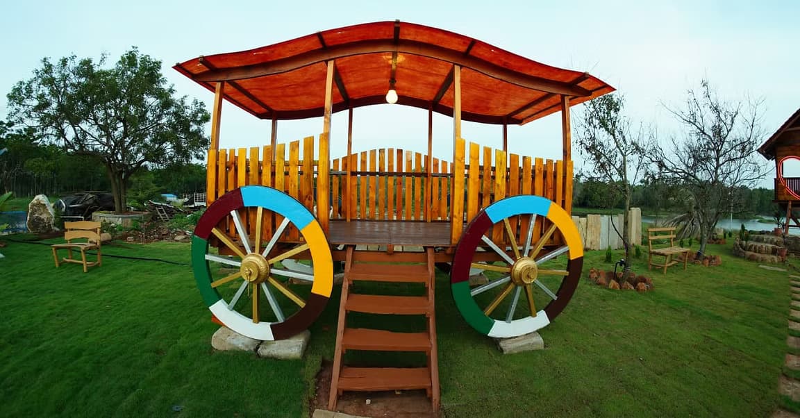 A colorful, hand-painted wooden pavilion set on the lawn