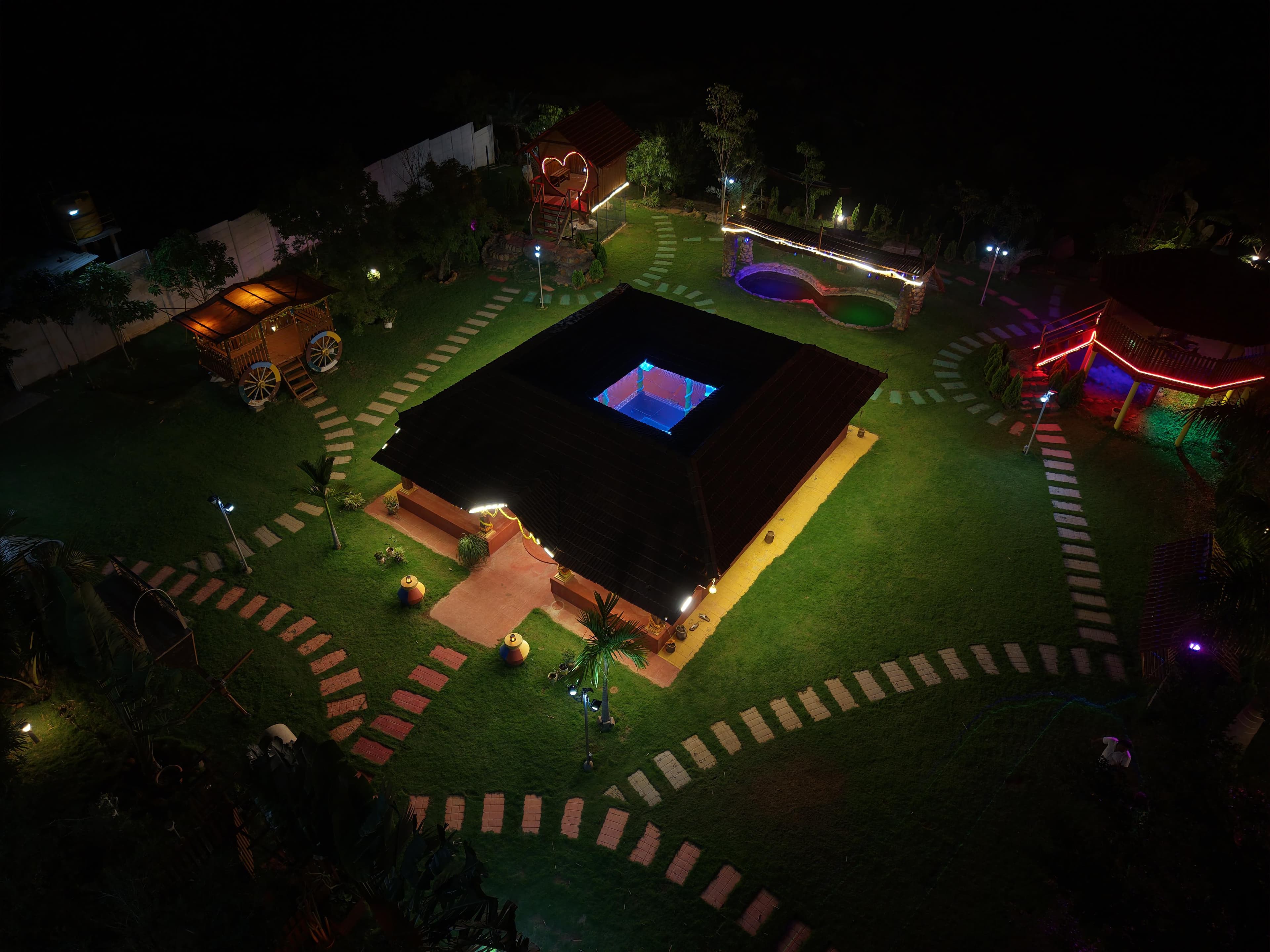 Vintage Farms lit up at night, seen from above